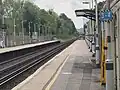 Southward view from Platform 1, with a Thameslink Class 700 approaching from Hassocks.