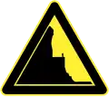 Road near mountain on left