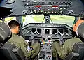 The cockpit of an Embraer ERJ with an M-shaped yoke