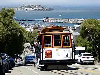 A cable car on a steep urban street