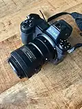 Mounted on a Nikon Z7 using the FTZ mount adapter, with lens cap attached