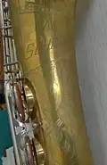 Rolled tone holes on the bell of a 'Carl Schiller' tenor saxophone, made by Dörfler & Jörka in Germany circa 1960s