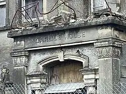 The portico of a derelict building known as the "Carlile House"
