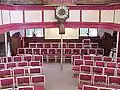 Chairs that replaced the pews in 1999 and Parliament clock (installed in 1818)