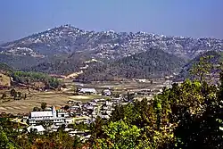 Champhai, Mizoram, from south, with Zotlang in the foreground. Taken from Ruantlang, across the Champhai Valley, with the town of Champhai stretched along the hill in the distance and the village of Zotlang in the foreground