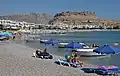 Plage, in the background is visible Feraclos Castle