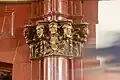 Faces on a column at the theatre.