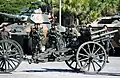 A Brazilian gun on wooden wheels with a limber draught by horses