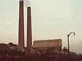 View of Courtaulds Chimneys with Boiler House visible in background and a caustic soda tank train delivering