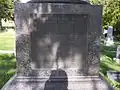 Detail from plaque of Daniel H. Wells's grave marker