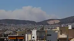 Smoke cloud from the Dervenochoria fire as seen from Ilion at 2:20&nbsp;pm on 18 July 2023.
