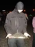 The first piece is taken as a souvenir by an unknown man