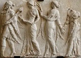 Procession of four figures, the first male