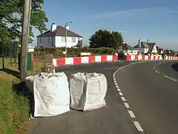 TT course safety devices at Douglas Road Corner, the right-hander entering Kirk Michael village