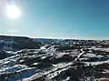 View to southwest in winter, from top of valley