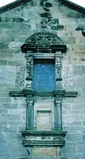 Carved stonework from an old fireplace at Dunlop House and a finial from the old kirk incorporated into the new church on the Dunlop Aisle