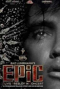 Promotional poster for EPiC: Elvis Presley in Concert. A close-up on half of Presley's face, his eyes glistening and his mouth partly open in a moment of deep performance. There are sparkles and jewels, akin to one of his signature jumpsuits. Tagline reads, "Elvis sings and tells his story like never before."