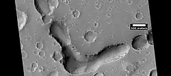 Large pits, as seen by HiRISE under HiWish program