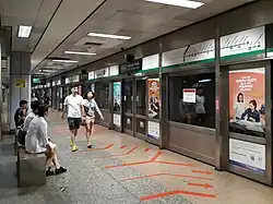Platform A of Outram Park MRT station, serving EWL services towards Pasir Ris MRT station. There is no train at the platforms, and the banners show the station name and the route of the EWL.