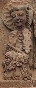 One of the 24 Elders of the Apocalypse with a plucked rabel.