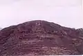Sloping parallel slots cut in the rock.