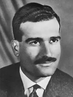 Black-and-white head shot of Cohen facing right
