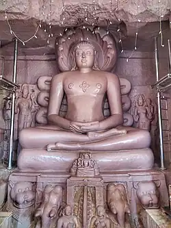 16 feet (4.9&nbsp;m) rock-carved image inside Ellora Jaina temple, 1234&nbsp;CE