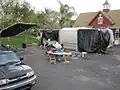 The ISS set built in a driveway, seen protected from the rain by plastic tarps