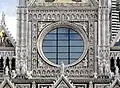 Oculus and vivid figures of the west facade