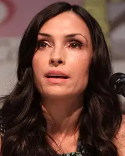A headshot of a Caucasian woman with brown hair.
