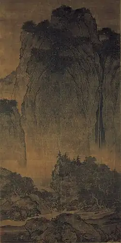 Fan Kuan (Chinese: 范寬; pinyin: Fàn Kuān; Wade–Giles: Fan K'uan, c. 960 – c. 1030), Travellers among Mountains and Streams (谿山行旅), ink and slight color on silk, dimensions of 6¾ ft x 2½ ft. 11th century, China.[52] National Palace Museum, Taipei[53]