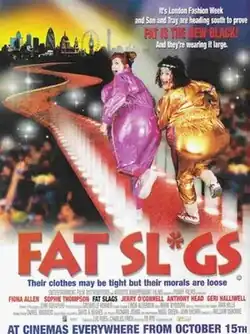 Two smiling women with their large breasts covered only by the word "censored"