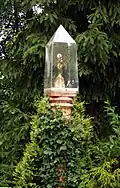 Monument with a Monstrance in Rybnik, Poland in front of the Church of St. Laurence