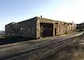 West rear and north side of Stable/Maintenance Building. View to south.