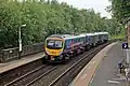 A First TransPennine Express Class 185 passes through the station.