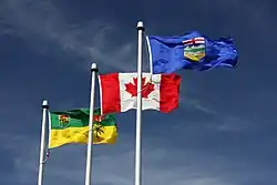 The flag of Saskatchewan flying alongside the flags of Canada and Alberta in Lloydminster
