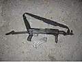 AKMS with commercial Picatinny rail fore-stock and folding pistol-grip attachment