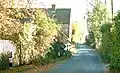 Former B2067 passing Court Farm in October 2003