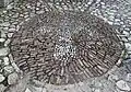 Lily, symbol of the Kingdom of Naples, in the internal pavement.
