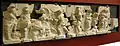 Frieze of the Basilica Aemilia: the punishment of Tarpeia, buried under a pile of weapons before the Sabine king Titus Tatius[16]