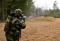 A GGFG soldier engaging a target during live fire training.