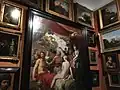 18th century style display of paintings