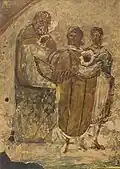 Stage one, the child. A man shows the garment of a consecrated nun to two children, one of whom is a girl.[14]