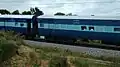 Gol Gumbaz Express negotiating curve near Yeliyur