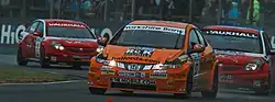Shedden's Civic leads two of the VX Racing Vauxhalls at the Croft round of the 2008 British Touring Car Championship season
