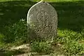 Old gravestone inscribed with the shahada