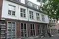 The shops in what was once known as the St. Joris Doelen, today called the Proveniershuis. The paintings of the civic guard of St. George by Frans Hals once hung in these two buildings (the building on the right corner was the meeting hall with the residence of the castelein or keeper attached).