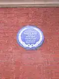 Plaque outside the embassy commemorating John Everett Millais
