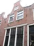 Klein Heiligland 1A, with the sign of the "young wolf", printshop where Heyboer lived and worked from 1952 to 1953.