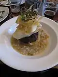 Haggis with neeps and tatties (mashed turnips and potatoes) in a whisky and barley broth. This dish was also served with a "wee dram" of Bell's Whisky on the side.
